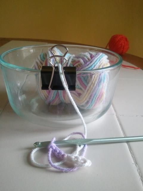Clip a binder clip on a bowl to make a simple yarn bowl